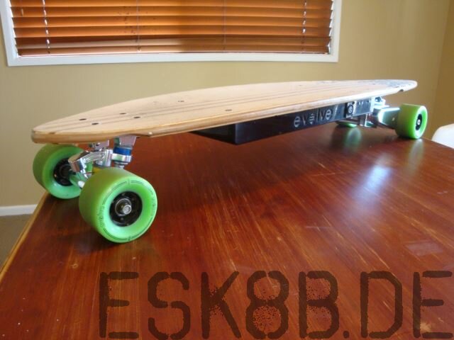 Evolve Pintail Electric Skateboard on the table