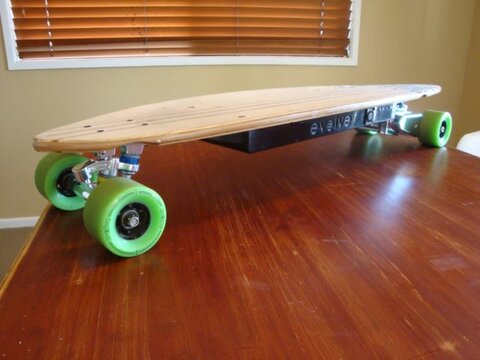 Evolve Pintail Electric Skateboard on the table